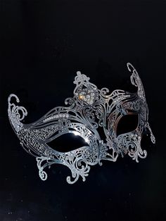 Step into the world of upscale glamour with our exquisite women's silver metal masquerade mask. The mask's silver shimmer adds an air of elegance, reflecting the light and adding a touch of enchantment to your appearance.

Age Group/Gender - Adult/Unisex

Size/Type - One size fits all adults

Mask Color - Silver

Shimmer Color - Silver

Mask Material - Lasercut Metal

Special Features - Rhinestones Elegant Adjustable Masquerade Mask, Elegant Adjustable Masquerade Mask For Mardi Gras, Elegant Adjustable Masks For Party, Elegant Adjustable Eye Mask, Elegant Adjustable Masquerade Mask For Wedding, Elegant Wedding Masquerade Mask Adjustable, Elegant Adjustable Wedding Masquerade Mask, Elegant Wedding Masks, Carnival Rhinestone Masquerade Mask