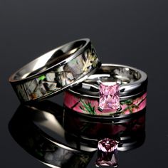 two wedding rings with pink and green camo inlays, one has a princess cut diamond