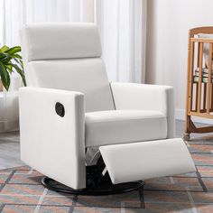 a white recliner chair sitting on top of a rug