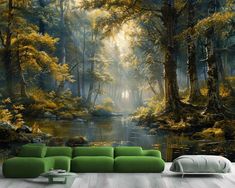 a living room with a green couch and wallpaper that has a forest scene on it