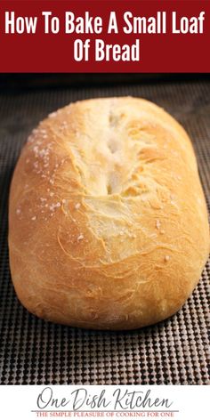 a loaf of bread sitting on top of a baking mat with the words how to bake a small loaf of bread