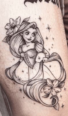 a woman's thigh with a drawing of a mermaid holding a bow on it