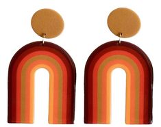 Step back in time to the funky 70s with these 70s Brown Groovy Rainbow Earrings. These earrings capture the essence of the era with their groovy rainbow design in shades of brown. Made from super lightweight acrylic, these earrings offer comfortable and effortless wear all day long. The posts are made of stainless steel coated in 18k gold, providing a luxurious look and ensuring they are nickel-free for sensitive ears. Product Details: Design: The 70s Brown Groovy Rainbow Earrings bring a burst of retro charm to your jewelry collection. With their playful rainbow design in various shades of brown, these earrings exude a groovy vibe that perfectly embodies the spirit of the 70s. Whether you're attending a themed party or want to add a touch of nostalgia to your everyday style, these earring 70s Aesthetic Earrings, 70s Accessories Jewelry Hippie, Gold Seventies Inspired Jewelry, 70s Jewelry Hippie Earrings, 70s Themed Earrings, Vintage Earrings 70s, 70s Accessories Jewelry, Cheap Orange Retro Earrings, Retro Rainbow Earrings For Gift