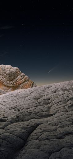 an artist's rendering of a rocky landscape with stars in the sky above it