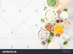 assorted fruits and vegetables on white marble table top view with copy space for text