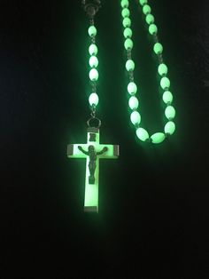 This Vintage Rosary Necklace features luminous, glow in the dark oval lucite beads made in Italy. To achieve this beautiful fluorescent glow, you can use an ultraviolet light...as used in the pictures using a 365nm black light. This piece is handmade, making it a very special addition to any fluorescent enthusiast's collection. Glows very bright! Pre-owned, great condition. Italy stamp is off center as shown in picture. Full length of necklace is 18 inches (including crucifix). Crucifix alone is 1.75 inches in length, and 1 inch in width.  Please view all pictures closely, as they are part of the description.  Thank you for looking! *I will be shipping this rosary in a small box for protection. Italy Stamp, Vintage Rosary, Black Lights, Ultraviolet Light, Rosary Necklace, Prayer Beads, Trendy Jewelry, Small Boxes, Black Light