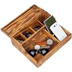 an open wooden box with two compartments filled with personal items on top of each other