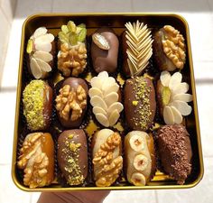 a box filled with assorted chocolates and nuts