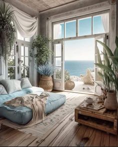 a living room filled with lots of furniture and plants on top of wooden flooring