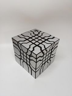 a black and white cube sitting on top of a table