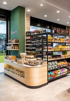 the inside of a grocery store with shelves full of food and condiments on display