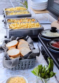 several trays of food sitting on top of a table