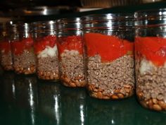 several jars filled with different types of food