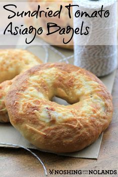 two bagels sitting on top of a piece of paper