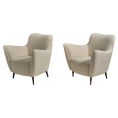 pair of armchairs in the manner of gio ponti