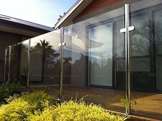 an outside view of a house with glass walls