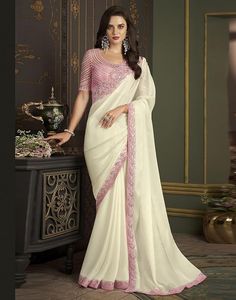 Women's beautiful off white chiffon saree with embroidery and unstitched blouse piece, Saree Fabric is Chiffon and Blouse Fabric is Net, Banglori Silk (Art Silk) ,saree has border in pink colour sequence embroidery,Length of  Saree is 5.50Mtr and Blouse is 0.80Mtr, Which Need To Be Stitched As Per Size And Fit,Colour of Saree is Off White & Pink and Blouse Color is Light Pink.
by the brand:"SIRIL"
available on Amazon , click on the pin to visit the site Saree Designs Party Wear, Salwar Kamiz, Utsav Fashion, Designer Sarees Online, Party Kleidung, Art Silk Sarees, Trendy Sarees, Indian Dress, Stylish Sarees