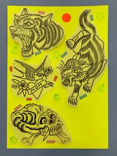 three stickers on a yellow background with black and white images of tiger's