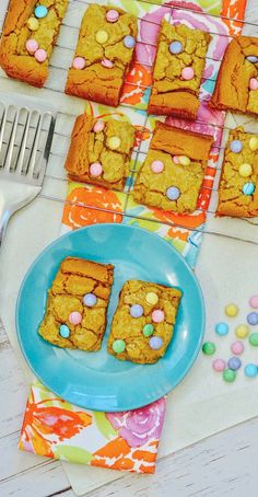 a table topped with cookies and candy bars