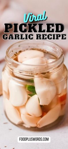 a jar filled with pickled garlic on top of a table