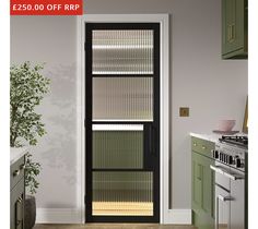 an open door in a kitchen next to a potted plant and stove top oven