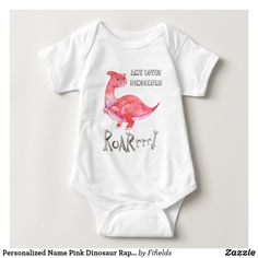 a white baby bodysuit with an image of a pink dinosaur on it's chest