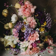 a bunch of flowers that are sitting on a table