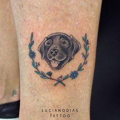 a dog's head is shown in the center of this tattoo