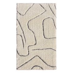 a white rug with an abstract design on the bottom and black lines in the middle