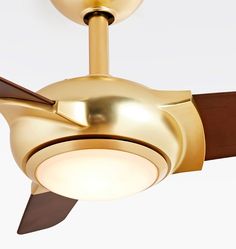 a gold ceiling fan with two wooden blades and a light on the top of it