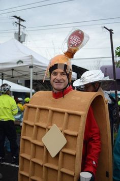 a man in a costume with a bottle on his head