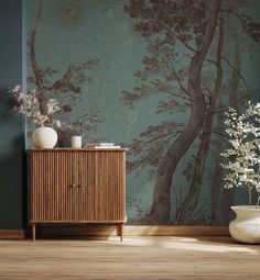 a vase with flowers sitting on top of a wooden cabinet in front of a painting