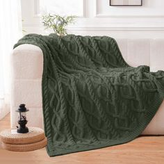 a couch with a green blanket on top of it