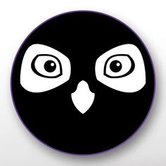 a black and white clock with an owl's face in the middle of it