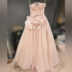 a dress hanging on a rack in a room