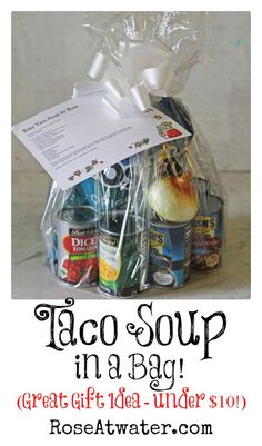 a bag filled with food sitting on top of a table next to a sign that says, taco soup in a bag great gift idea - under $ 10