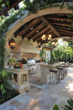 an outdoor kitchen and dining area is shown