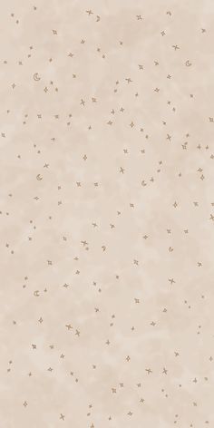 an abstract beige background with tiny stars on the left and right side of the image