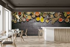 an empty restaurant with many different types of food on the wall and wooden flooring