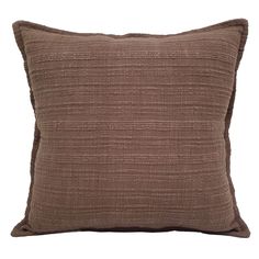 a brown pillow on a white background