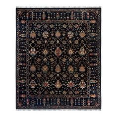 a black rug with an ornate design on the front and side, in various colors