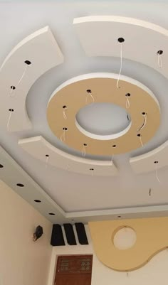 the ceiling is decorated with black and white dots on it's circular circle design