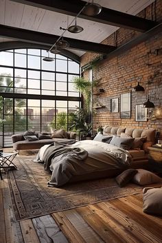 a large bed sitting in the middle of a bedroom next to a tall brick wall