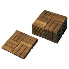 several pieces of wood sitting on top of each other in the shape of square tiles