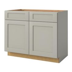 a gray cabinet with two doors and one drawer on the bottom, is shown in front of a white background