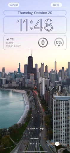 the city skyline is shown with an iphone app on it's screen, and there are cars driving down the street