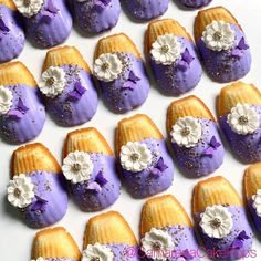 purple and white desserts with flowers on them