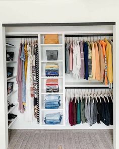 an organized closet with clothes and shoes