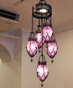 a chandelier hanging from the ceiling in a room