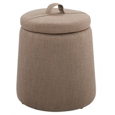 a round ottoman with a lid and handles on the bottom, in light brown fabric